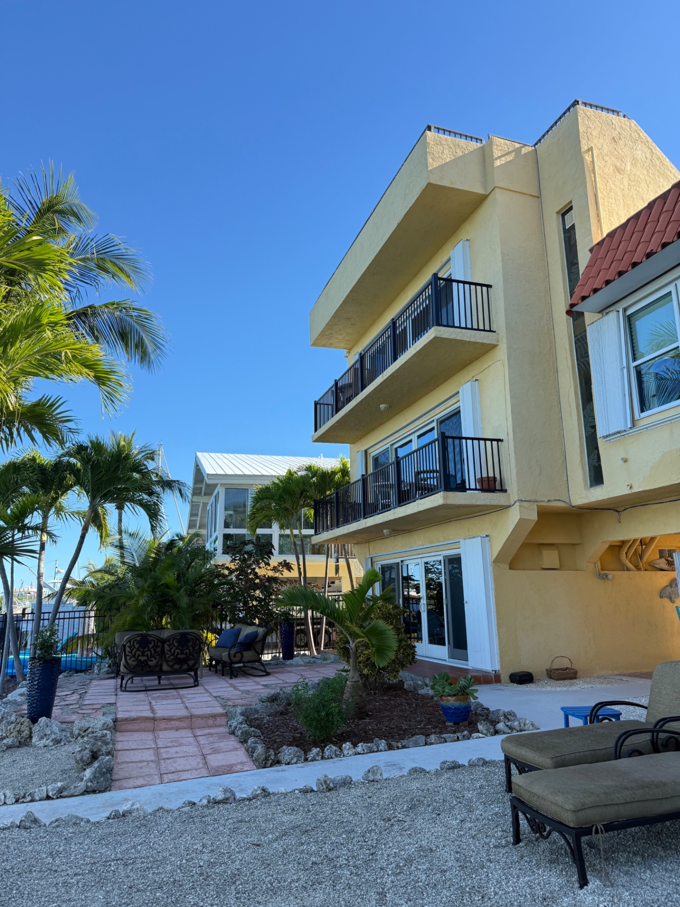 Bayside Manor waterfront vacation home with a pool and outdoor living area