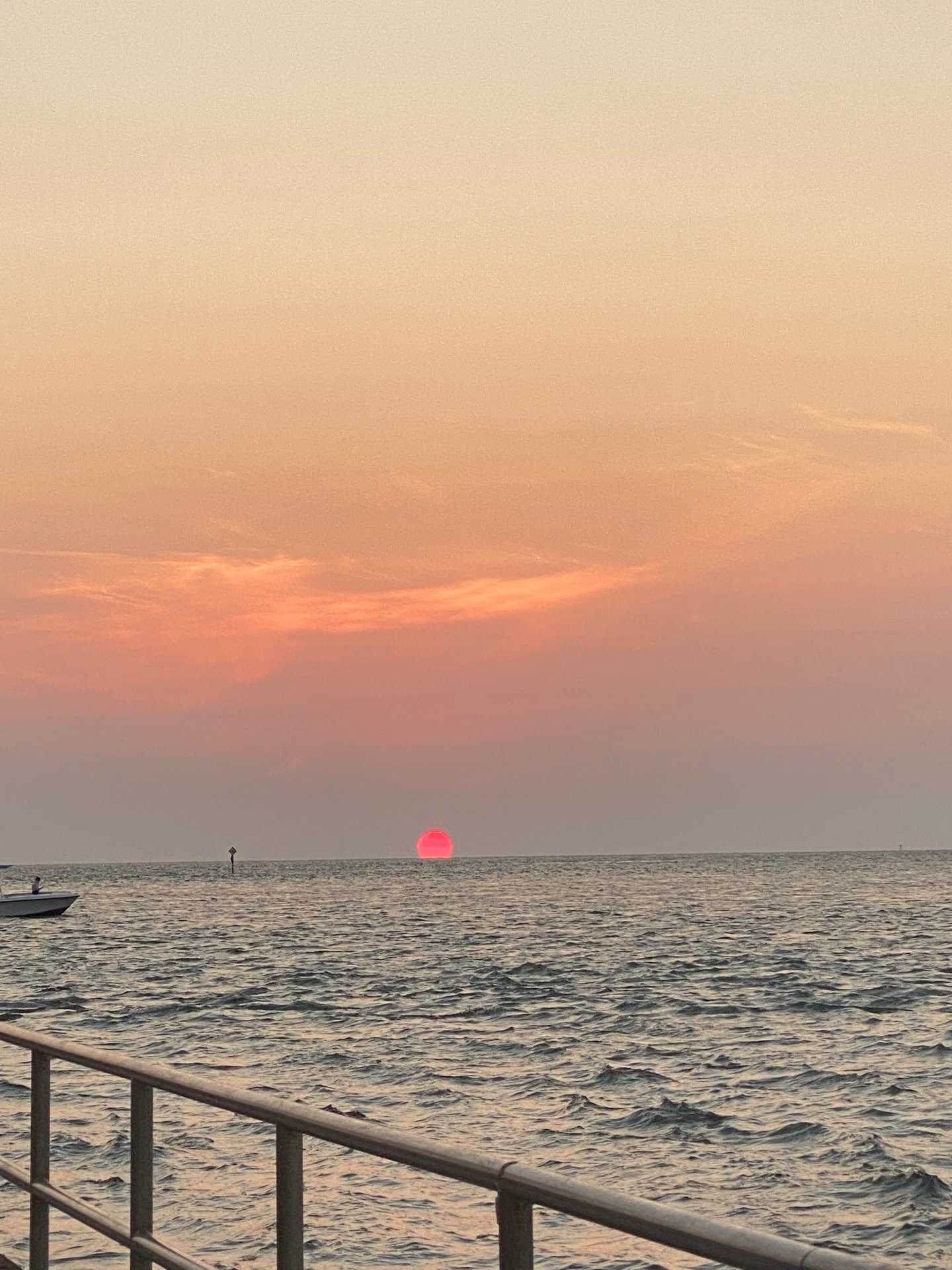 Golden sunset over the Florida Keys with palm trees and calm turquoise water